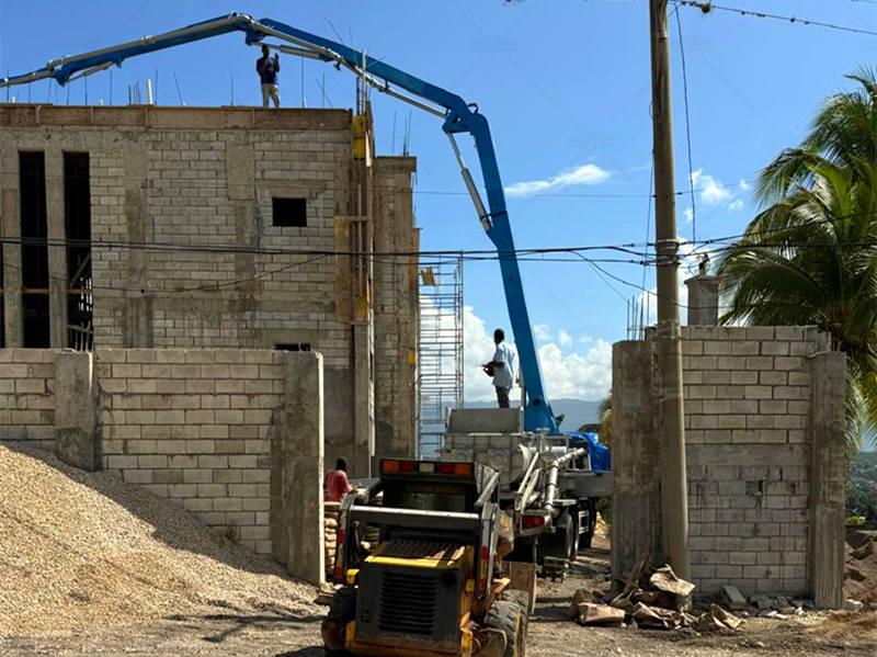 mobile truck mounted concrete pump onsite operating