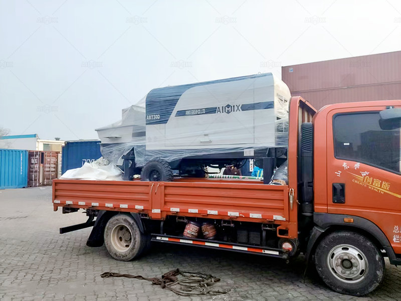 small trailer concrete pump for sale being transfered by flatbed truck