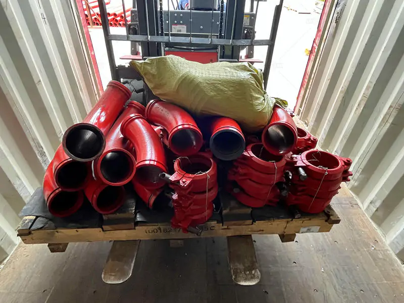 forklift transport pumping pipes into container